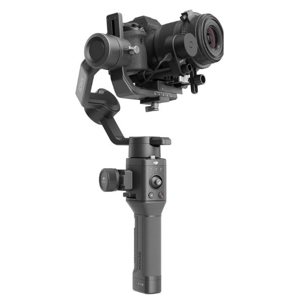 Professional filmmaker using a DJI Ronin-SC Pro gimbal for smooth footage, FeiyuTech SCORP-C Max gimbal stabilizing a heavy cinema camera, Zhiyun Weebill 3E Pro gimbal in sling mode for low-angle shots, comparison between a gimbal and tripod for camera stabilization, videographer adjusting settings on a DJI RS 3 Mini Pro gimbal.
